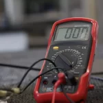 test car battery with multimeter