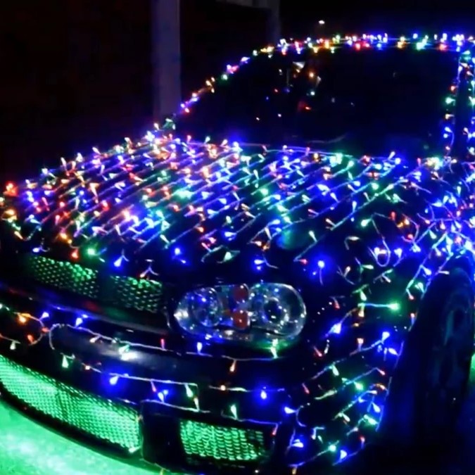 car wrapped in christmas lights