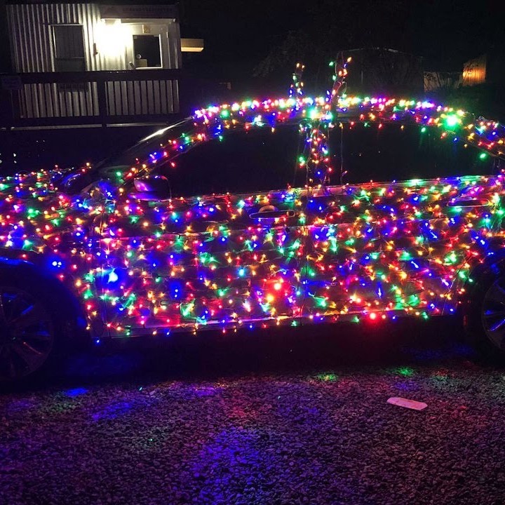 car wrapped in christmas lights